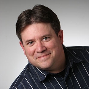 A middle-aged white man smiling