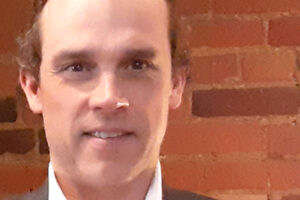 A photo of John Crosbie, a Carleton University Philanthropy student.