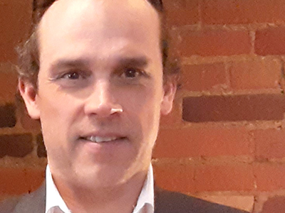 A photo of John Crosbie, a Carleton University Philanthropy student.