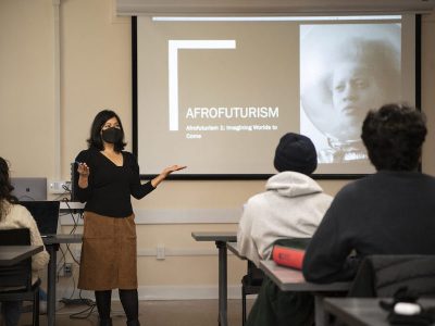 Dr. Malini Guha teaching a class on Afrofuturism