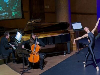 Pianist, cellist and ballet dancer performing on stage.