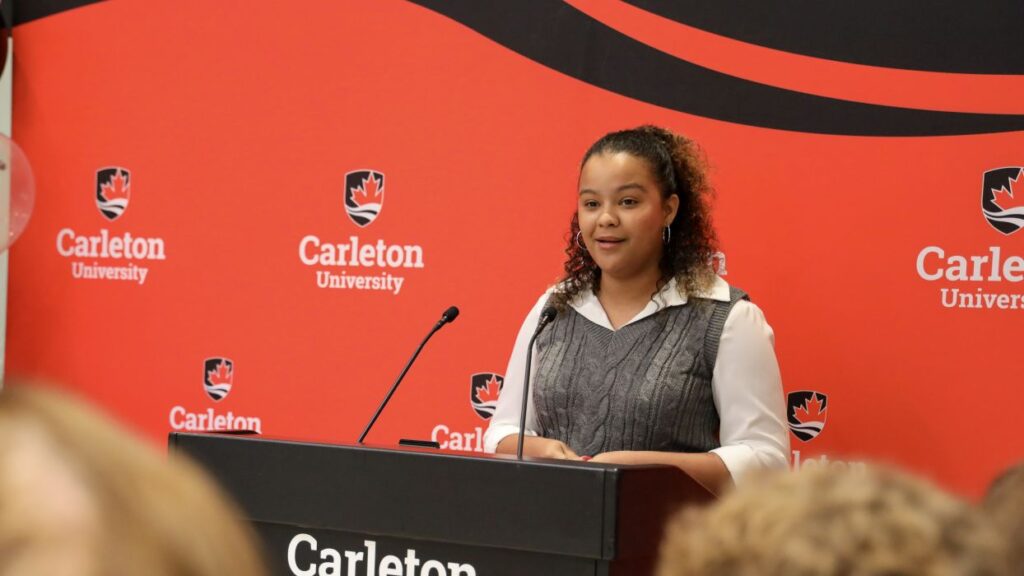 Journalism student Carolyne Bergeron speaks during the grand opening of the Rideau House Residence. 