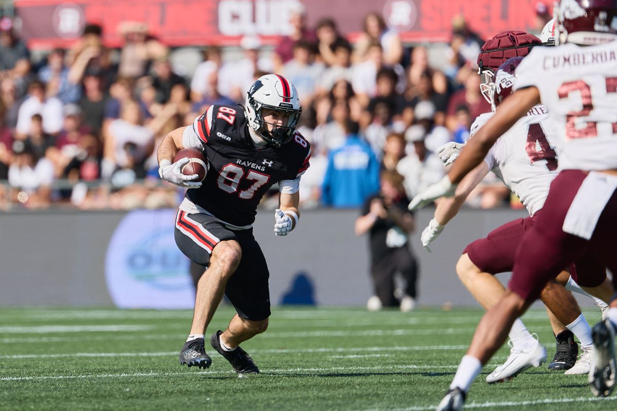 A Ravens football player runs on the field at the 56th Panda Game.
