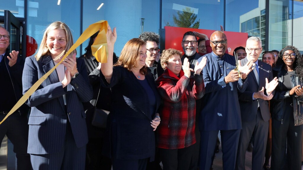 Members of the university's leadership team cut the ceremonial ribbon at Rideau House Residence's grand opening event.