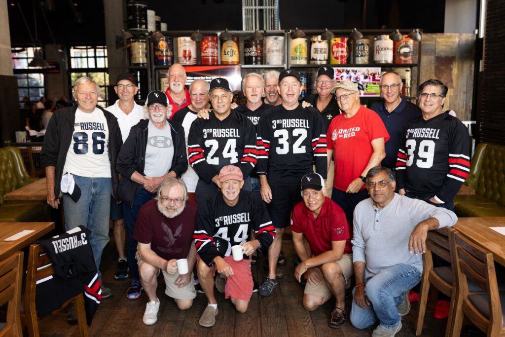 Alumni of third floor Russel building gather for a photo at the Pancaker Breakfast event.