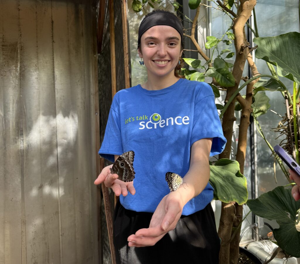 Carleton student at the 26th annual Biology Butterfly Show.