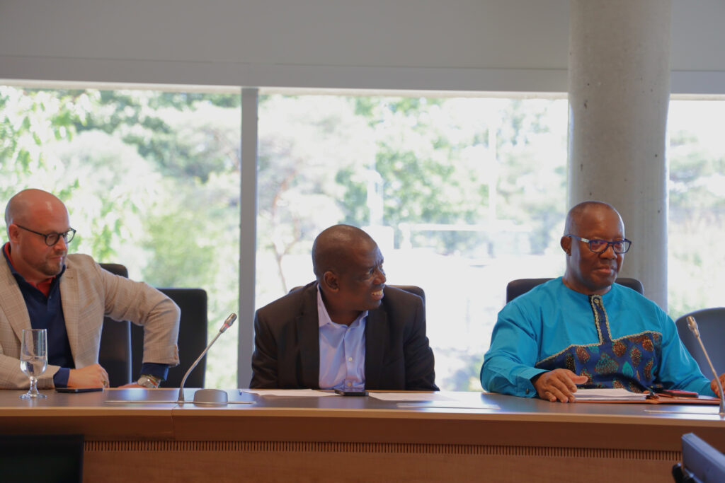 David Hornsby, Samuel Ojo Oloruntoba, Nduka Otiono discussing at the MOU signing