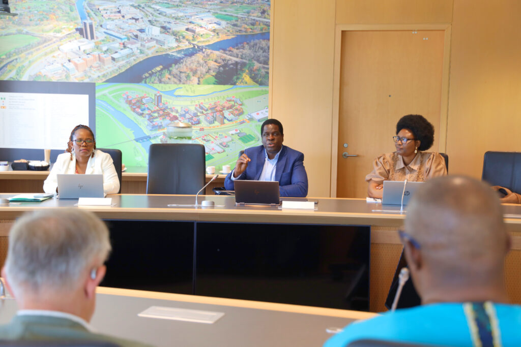 Inocent Moyo discussing at a table