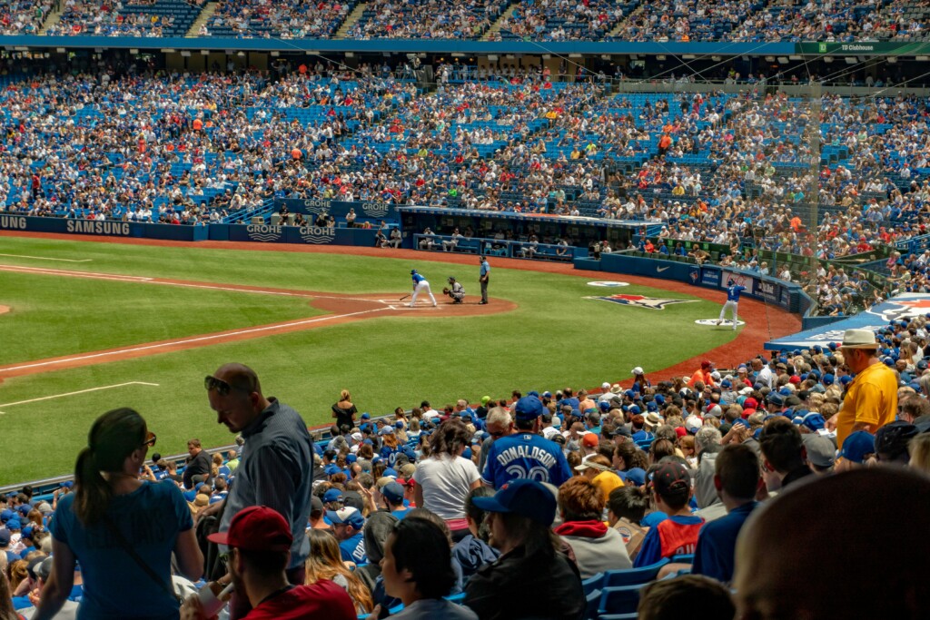 A batter gets ready for a pitch at a Toronto Blue Jays baseball game.