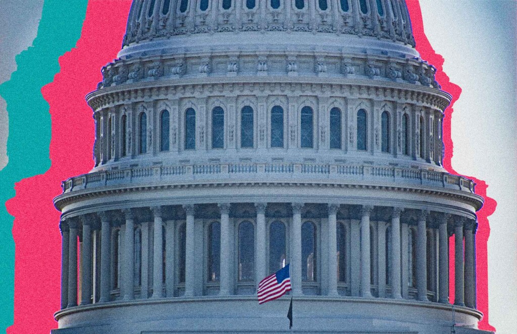 United States Capitol Building with an American flag in front of it.