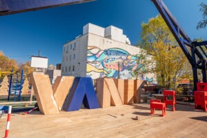 Vibrant public spaces at Vanier Hub in Ottawa, showing the completed outdoor structure and community gathering area designed through inclusive architecture.
