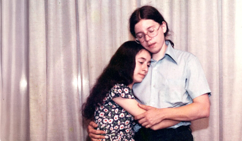 A young couple embracing.