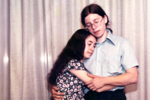 A young couple embracing.