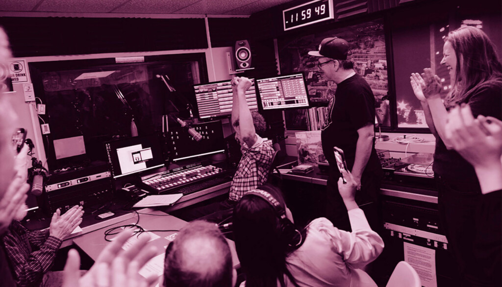 Several people inside the CKCU radio station studios.