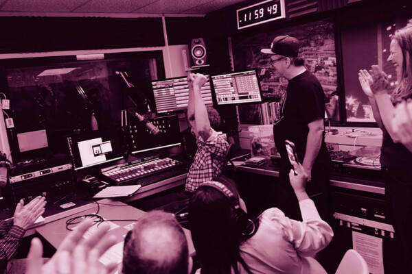 Several people inside the CKCU radio station studios.
