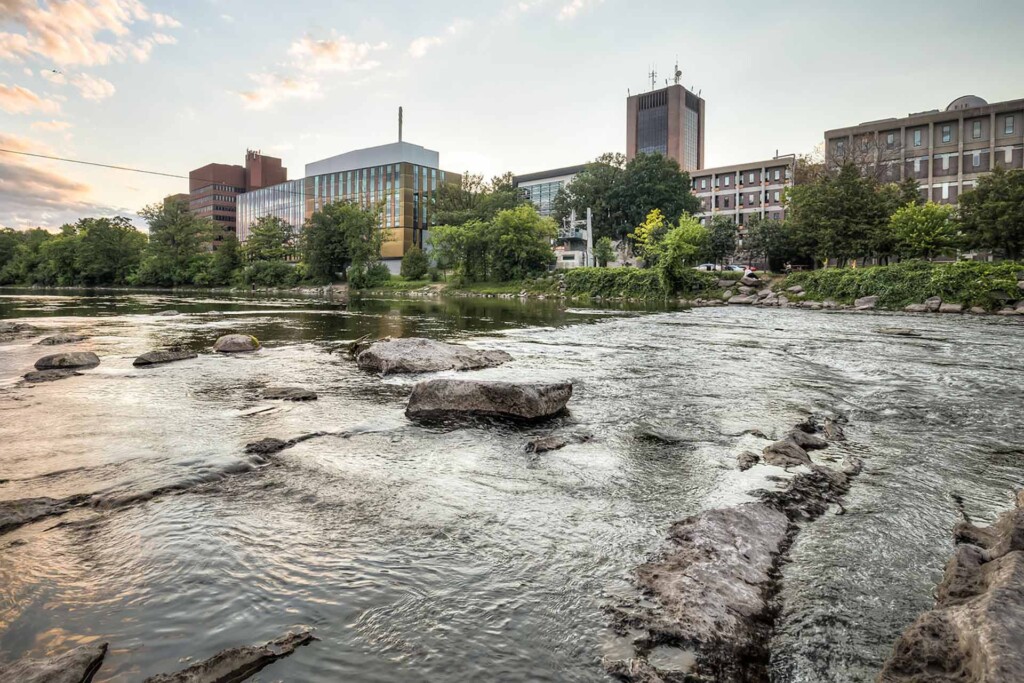 A river running alongside a university campus.