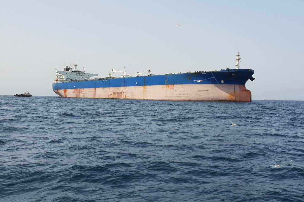 Oil tanker in the Strait of Hormuz highlighting global stakes in the Iran war debate.
