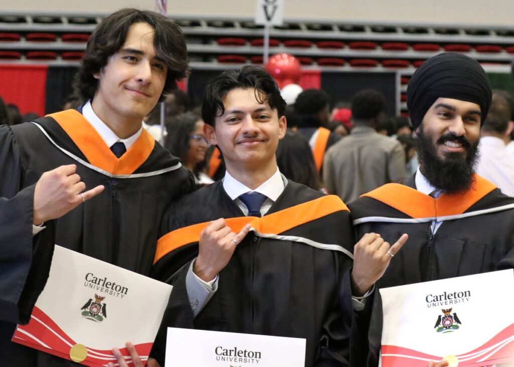 Graduating Engineering students display their degrees and Iron Ring at Spring Convocation.