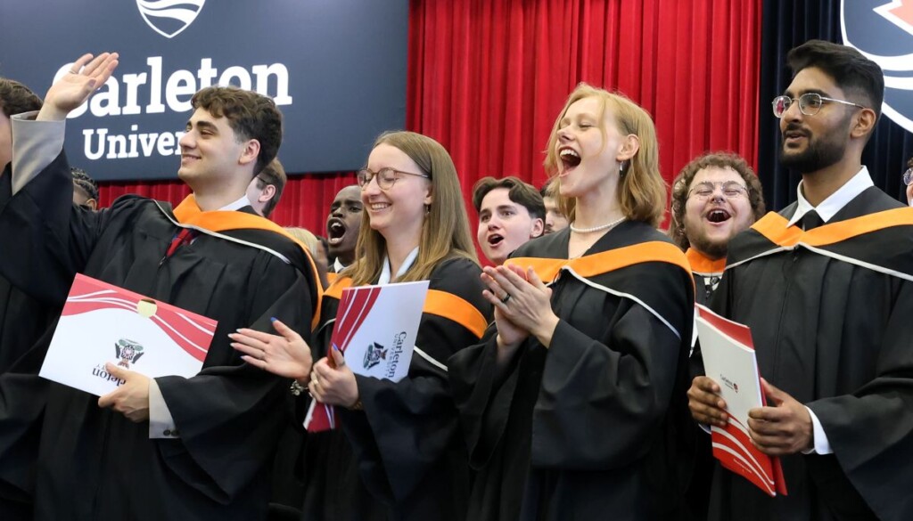 A group of students cheer at Convocation