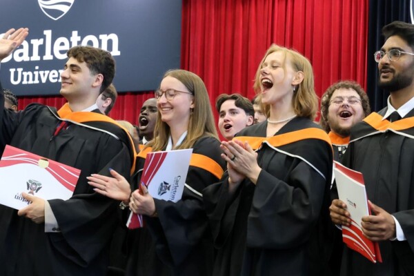 A group of students cheer at Convocation