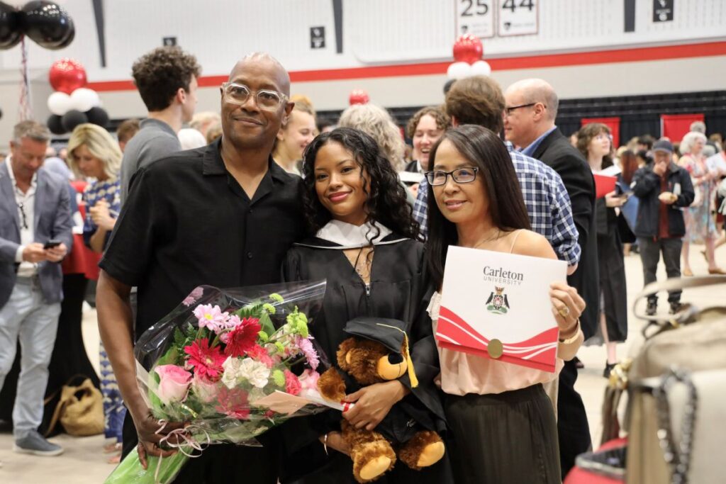 A graduating student and her supporters pose for a photo after receiving her degree.