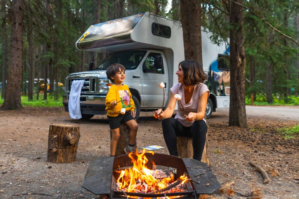 Family camping in a Canadian forest as researchers study West Nile Virus Canada risks during mosquito season.