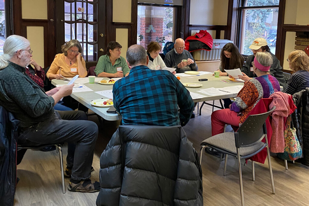 Several people sitting around a table.
