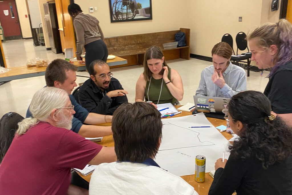 A large group of people sitting at a table.