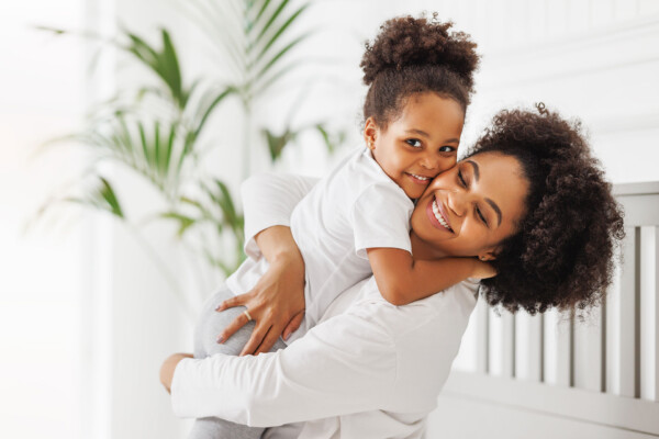 A woman holding a child.