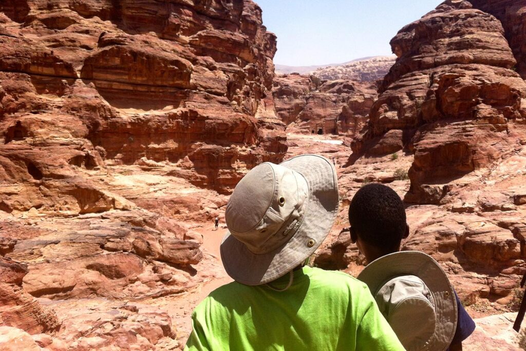 The Greenwood Davis family's sons explore a rocky landscape during their around-the-world adventure.
