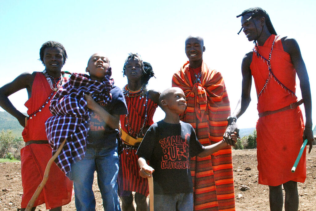 Heather Greenwood Davis's sons meet local community members during the family's travels that inspired Globe Bros.