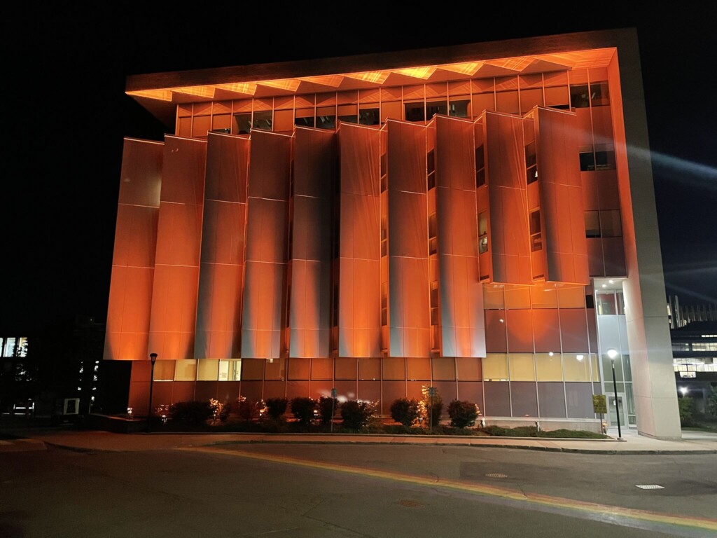 Carleton Campus building lit orange in honour of Orange Shirt Day