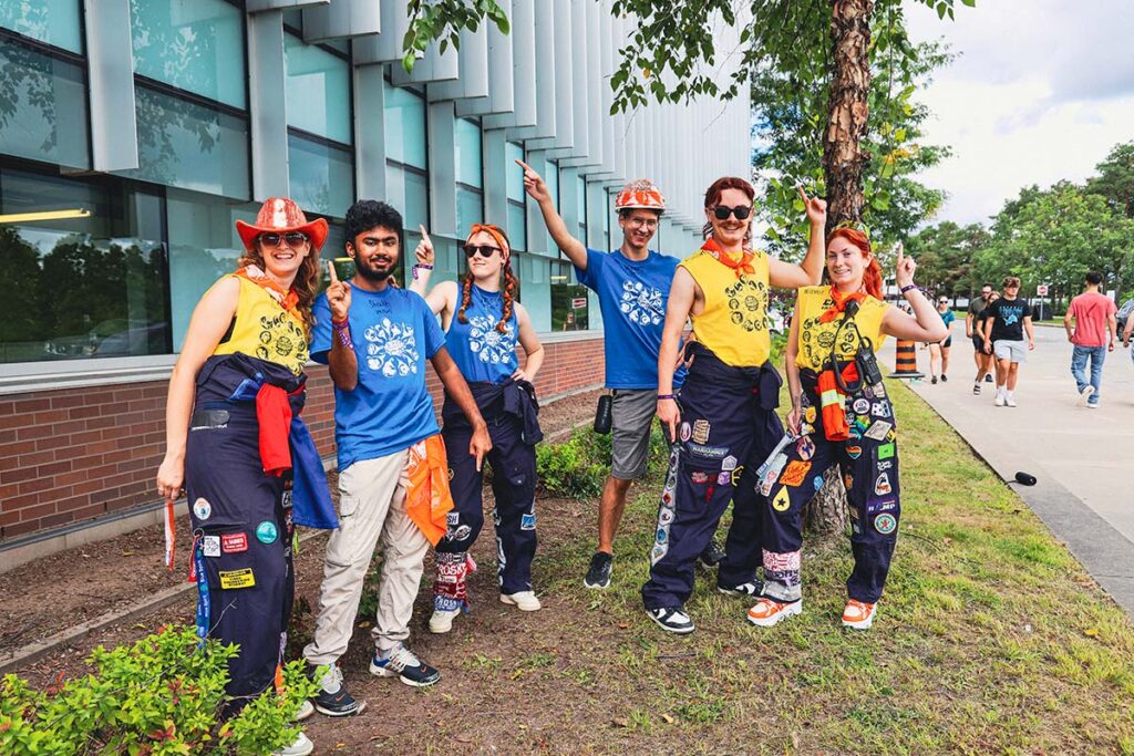 Several people posing for a group photo.