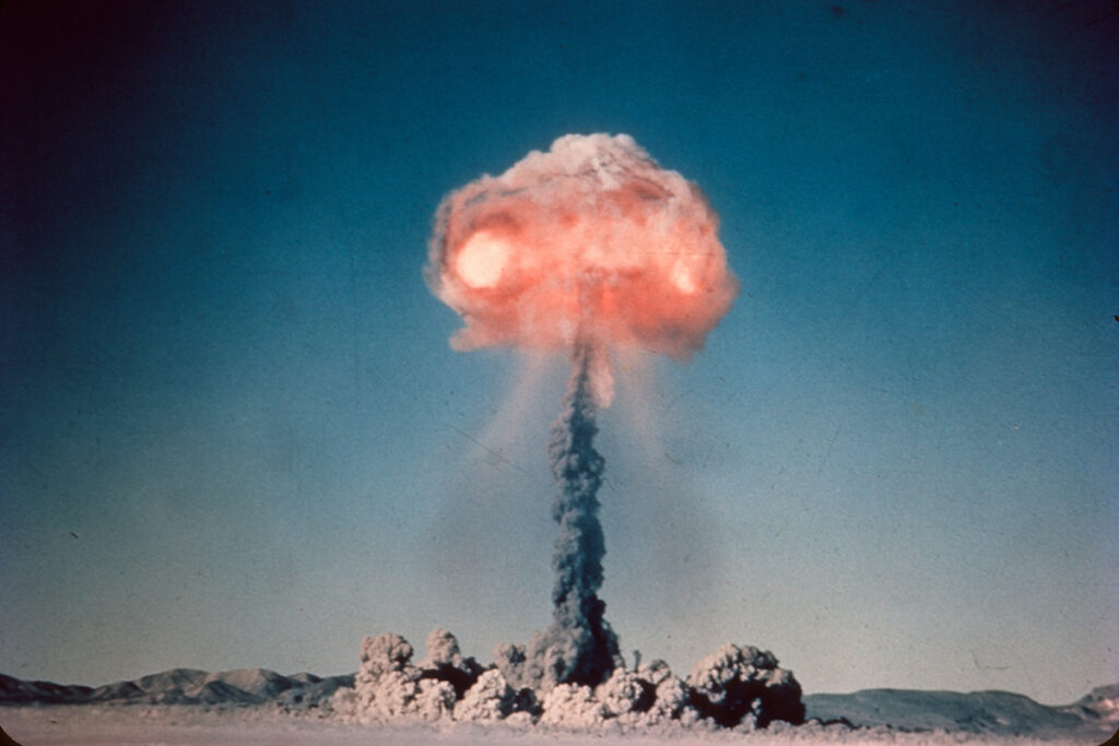 Old slide scan of atom bomb exploding in the desert.