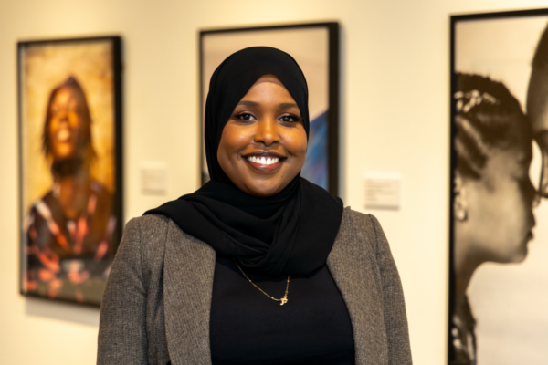 Woman in black head covering poses for a photo.