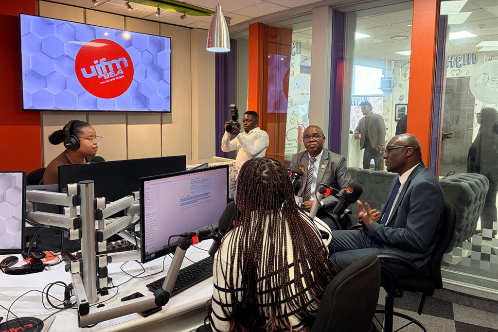 Carleton delegates take part in a discussion at a university radio studio.