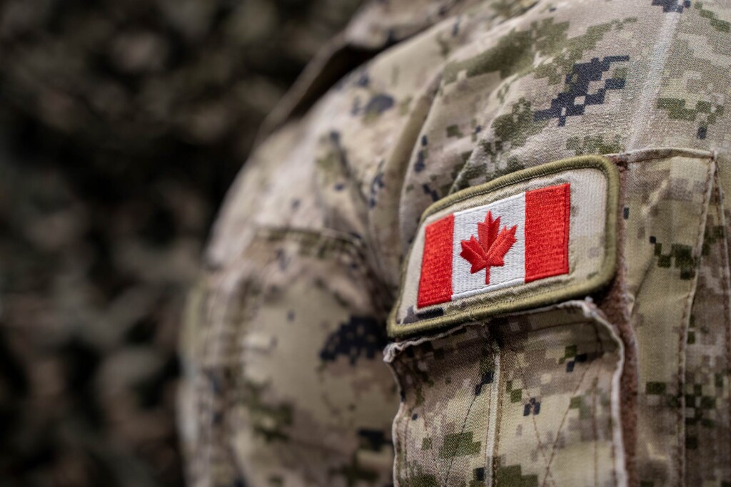 Close up of Canadian flag patch on military uniform.
