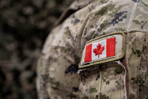 Close up of Canadian flag patch on military uniform.