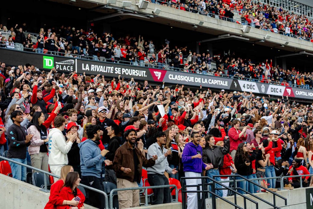 Carleton Ravens fans cheer in the stands at TD Place during Throwback 2026.