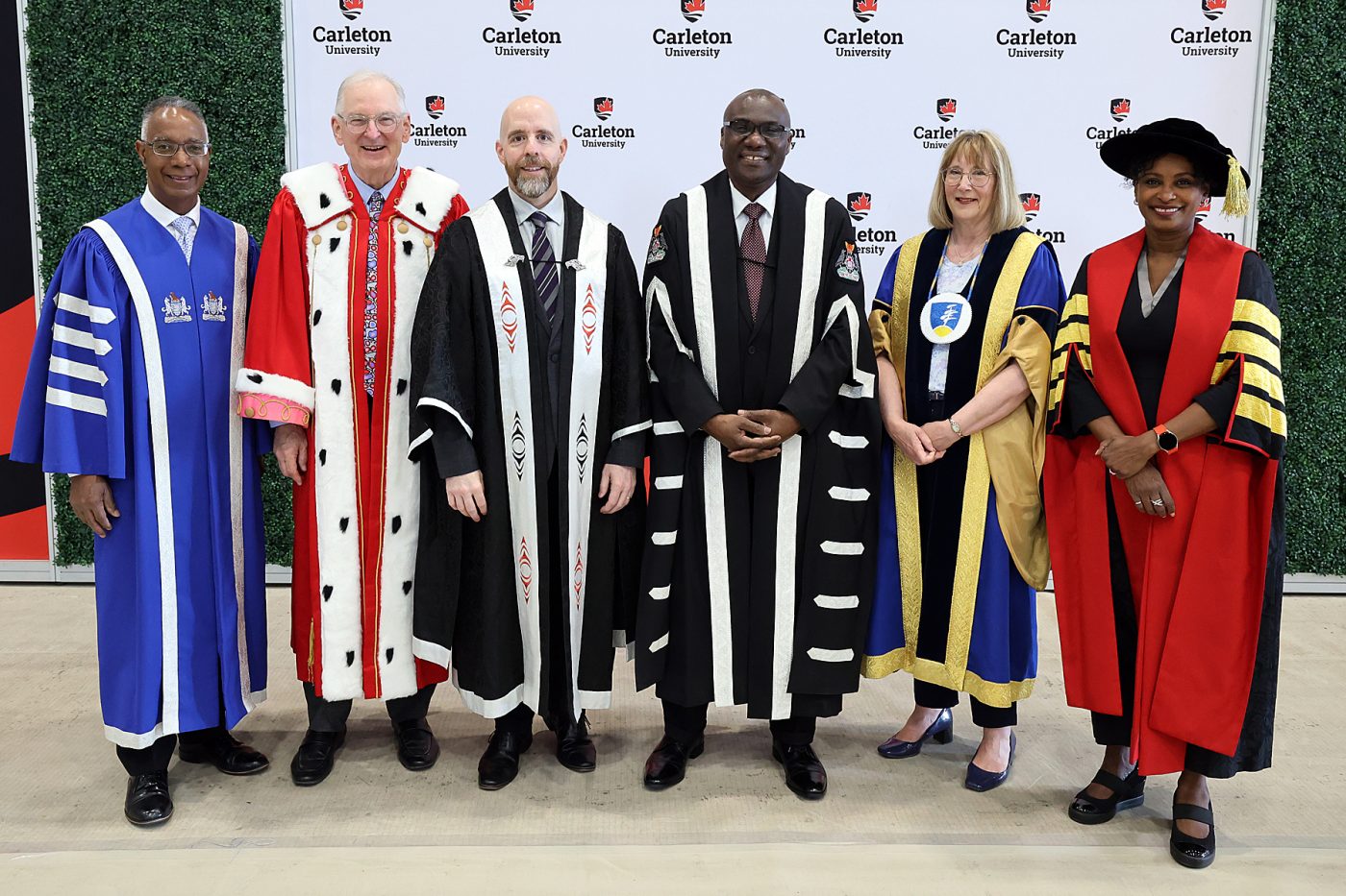 University President Wisdom Tettey stands with former University President Benoit-Antoine and other university presidents.