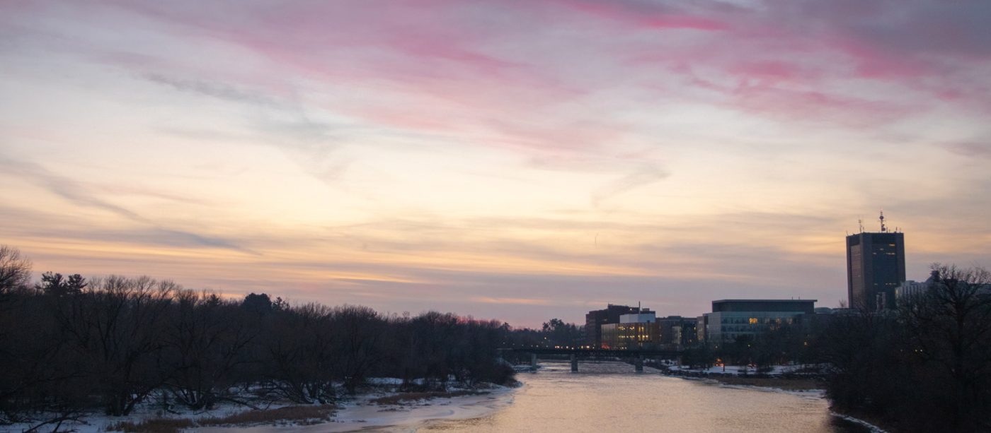A shot of the Rideau River and the southern edge of campus at dusk.