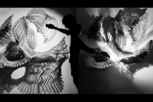 Students demonstrate Diluvio artwork.