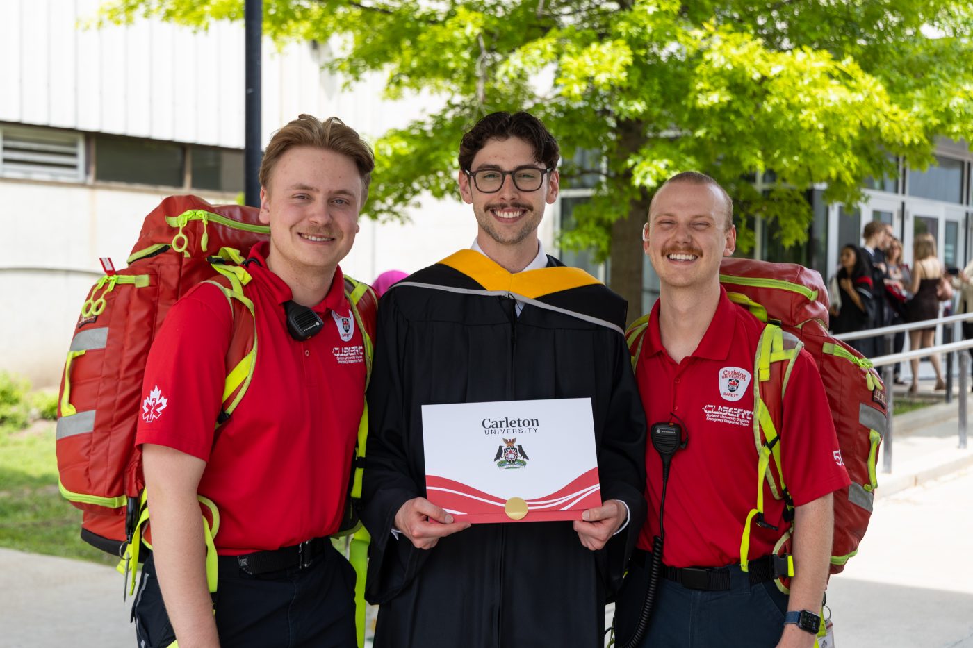 Graduating student Matthew Bacic poses with CUSERT team members.