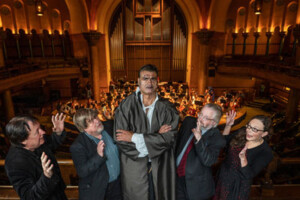 Conference organizers pose with Frankenstein opera actor.