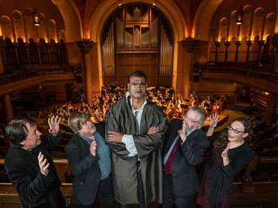 Conference organizers pose with Frankenstein opera actor.