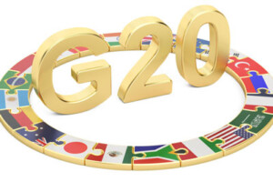 An artistic representation of the countries involved in the G20 meetings. Member countries' flags are illustrated as puzzle pieces forming a ring around 