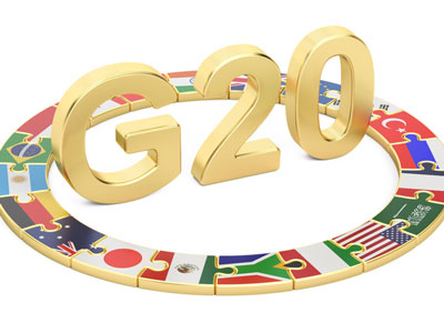 An artistic representation of the countries involved in the G20 meetings. Member countries' flags are illustrated as puzzle pieces forming a ring around 