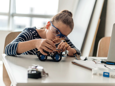 A girl works on an engineering project.