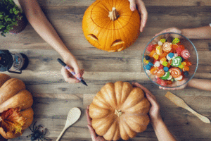 A photo of pumpkins and Halloween candy.