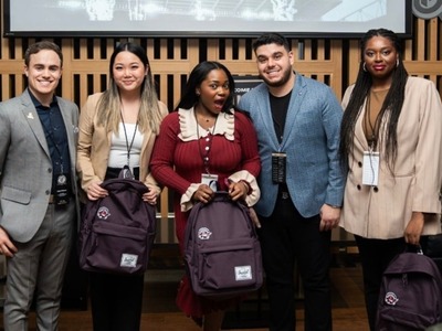 Winning team members Lauren Tham (second left), Itoro Umanah (centre), Jahnelle Woldegiorgis (right) and competition officials.